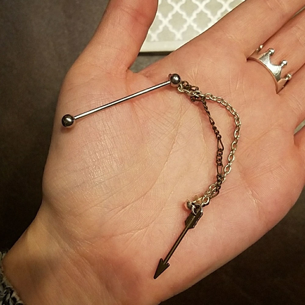 Industrial Barbell with chain to an ear piercing